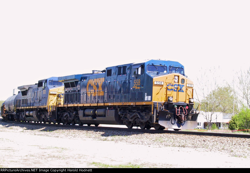 CSX 558 & 7670 lead a train down track 3